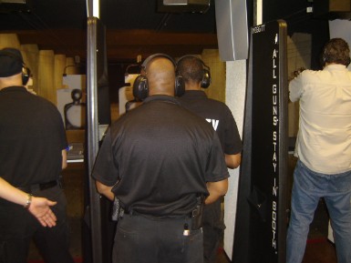 Instructors Leon S. Adams and Joseph Hibner give pointers to new shooters on the firing line