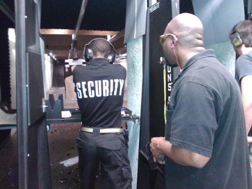 Instructor Leon S. Adams monitors a security officer during the live fire portion of Handgun Skills for Personal Defense