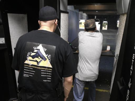 Instructor Joseph Hibner monitoring a student during the live fire portion of Introduction to Handguns for Self Defense